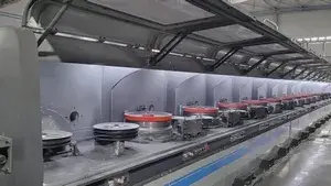 Machine de production de fils fourrés
